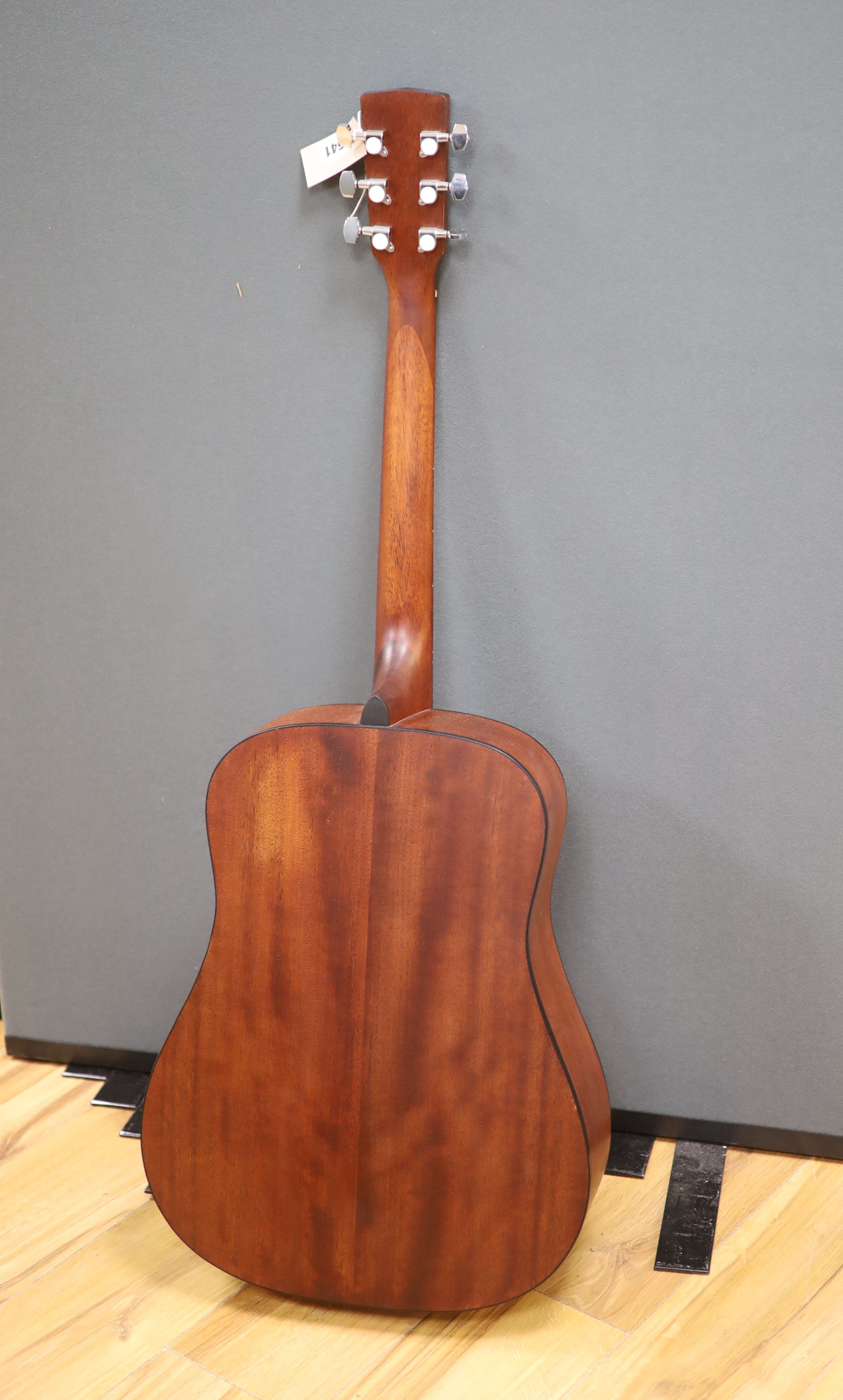 A Cort acoustic guitar